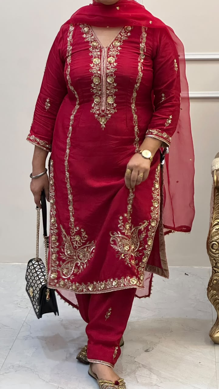 This is a rich wine/maroon Punjabi straight-cut suit with heavy traditional gold embroidery, designed in an elegant festive style. - Image 1